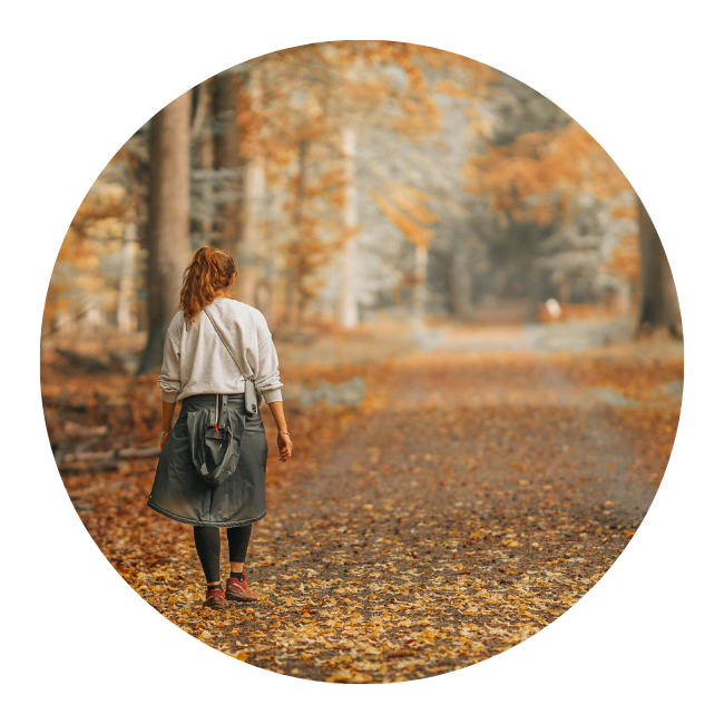 person walking down a trail