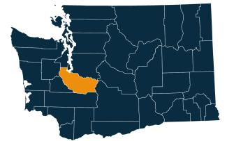 A dark blue map of Washington state with Pierce County highlighted in orange.