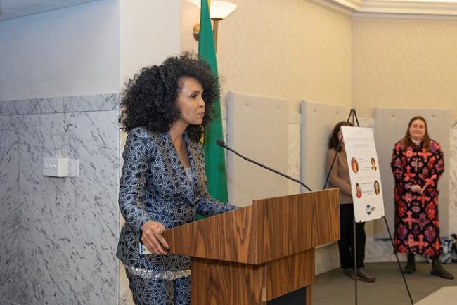 ESD’s Sanyu Tushabe speaks to a crowd while being honored at statewide awards for women leaders on March 1, 2024.