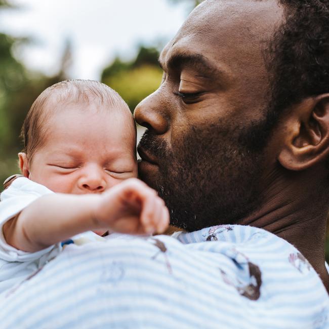 Man holding child.