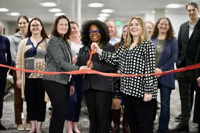ESD Commissioner Cami Feek helps cut the ribbon for the new WorkSource Everett center.