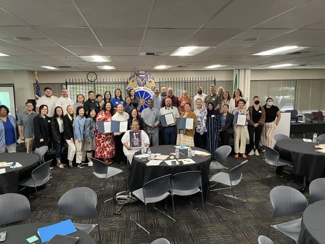 Unemployment Insurance Navigator program participants pose for a photo.